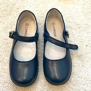 Navy l’Amour Mary Janes. Never been worn.